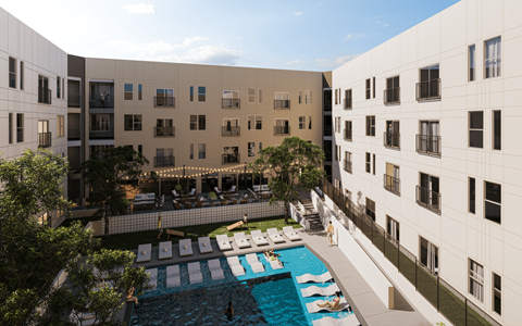 A swimming pool is surrounded by lounge chairs and umbrellas.